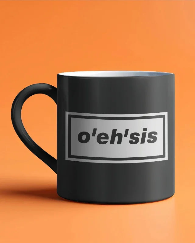 Black mug with 'o'eh'sis' text on an orange background